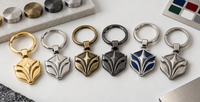 Llaveros metálicos personalizados con acabados dorados, plateados, oro viejo, níquel negro, esmaltes de colores y relieves 3D